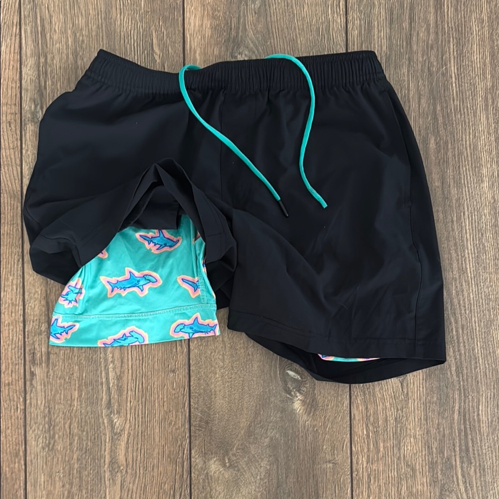 chubbies Black Athletic Shorts with Teal Shark-Print Liner